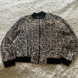 Glitter zip up jacket with velvet embellishments.